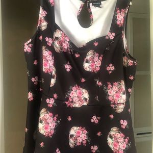 Soft peplum with skull and flower design